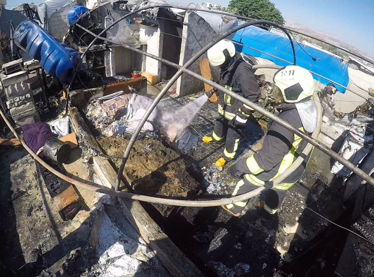 Man injured in a fire in al-Wafaa Camp in W. Idlib, July 12, 2024